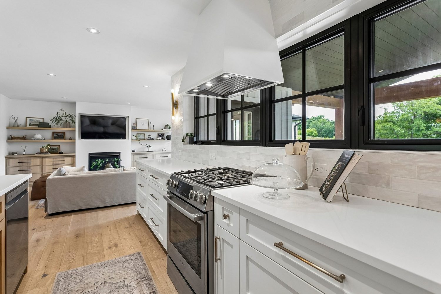 Designer kitchen with hickory island and brass pendants